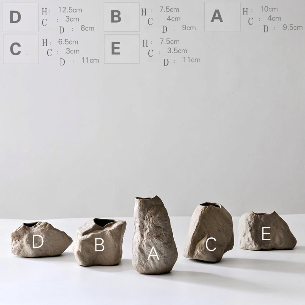 Set of stone vases with size labels on a white background