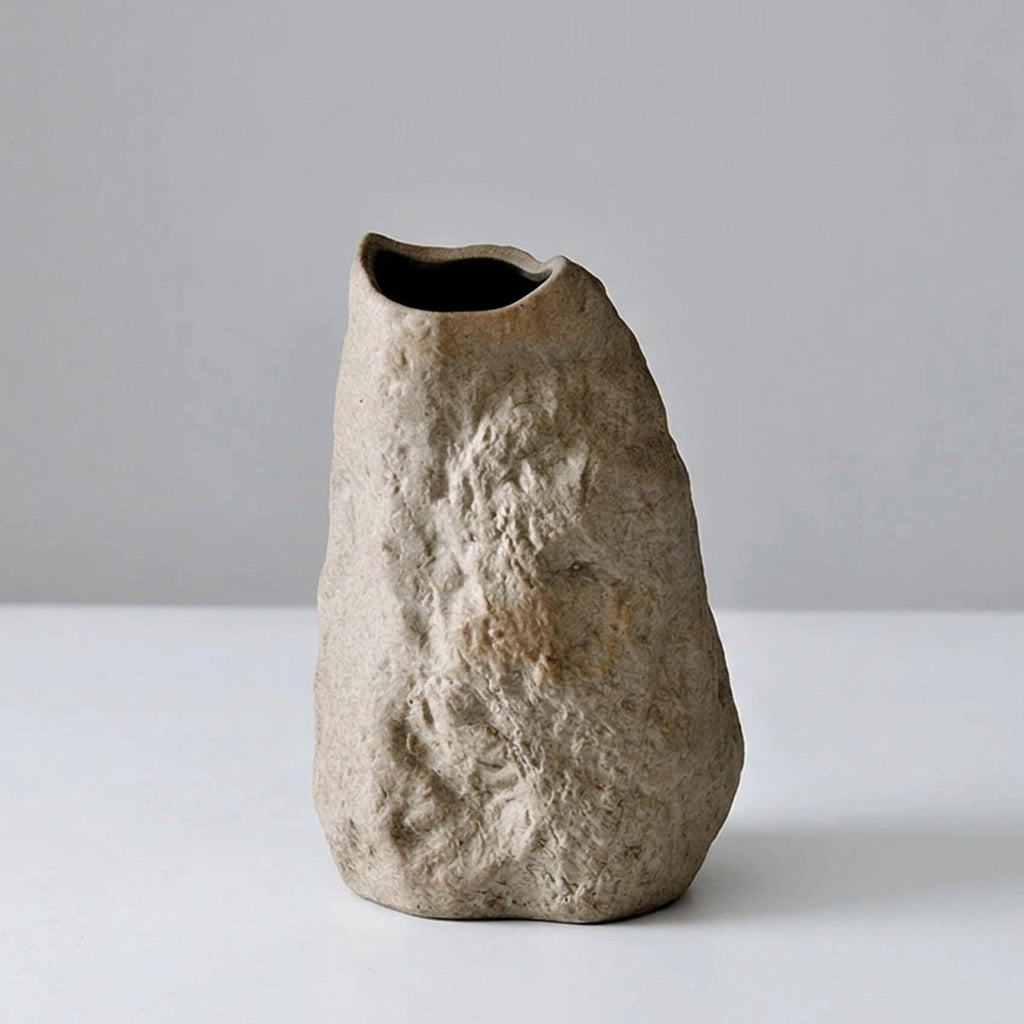Rustic stone vase on a light gray background