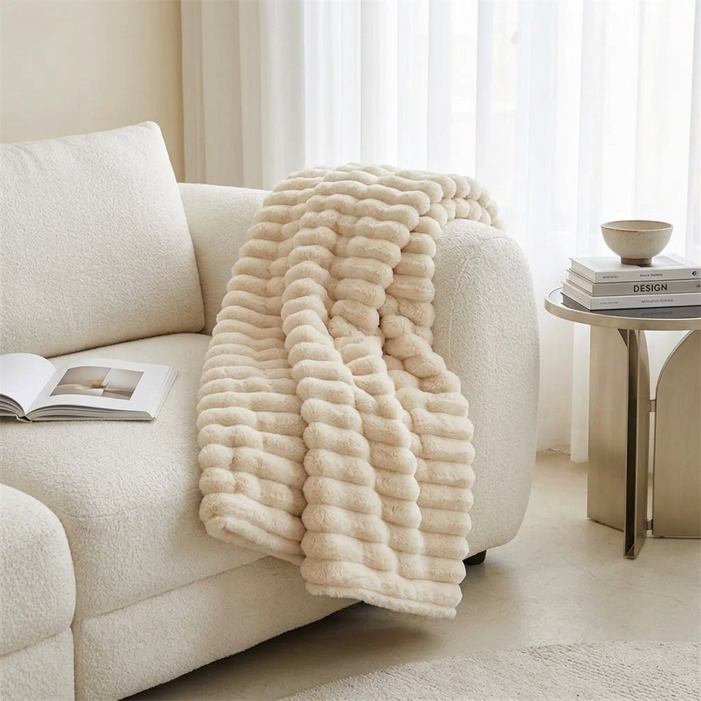 Person holding a large beige plush toy in a living room setting