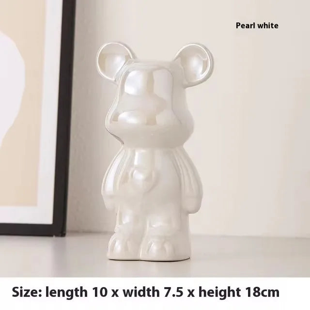 A glossy pearlescent white bear-shaped decorative object displayed on a tabletop, with text reading 'Pearl white' and size information at the bottom.